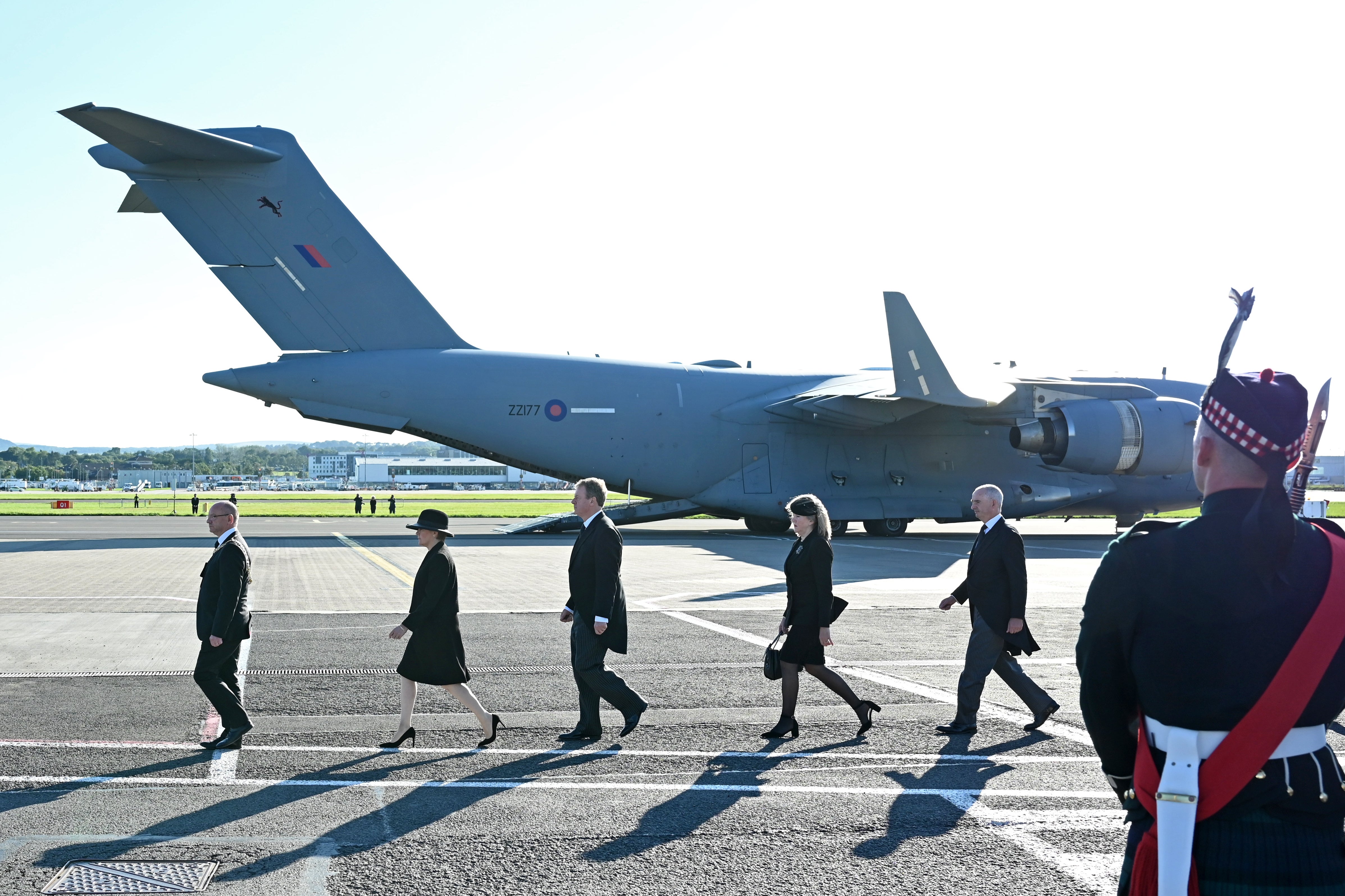 Dignitaries prepare for the arrival of the coffin of Queen Elizabeth II at Edinburgh Airport (PA)