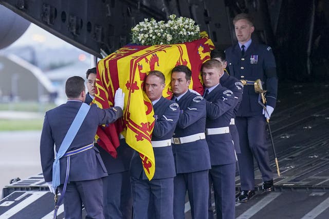 <p>The bearer party from the Queen’s Colour Squadron carry the Queen’s coffin to the state hearse (Arthur Edwards/The Sun)</p>