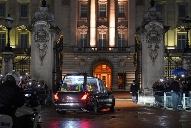 The hearse carrying the coffin of Queen Elizabeth II arrives at Buckingham Palace (PA)