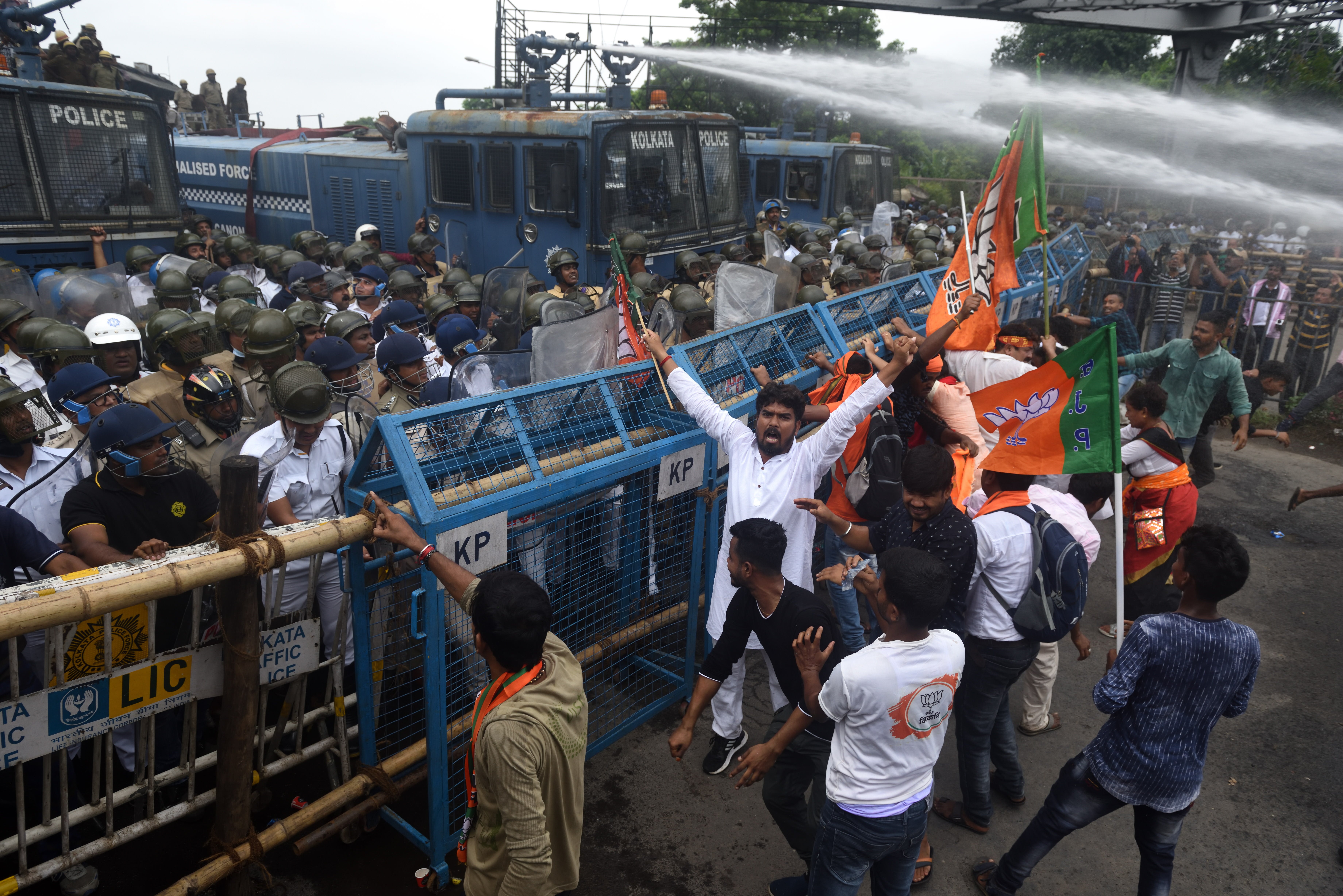 Members of the Bharatiya Janata Party clash with Kolkata police during protest rally