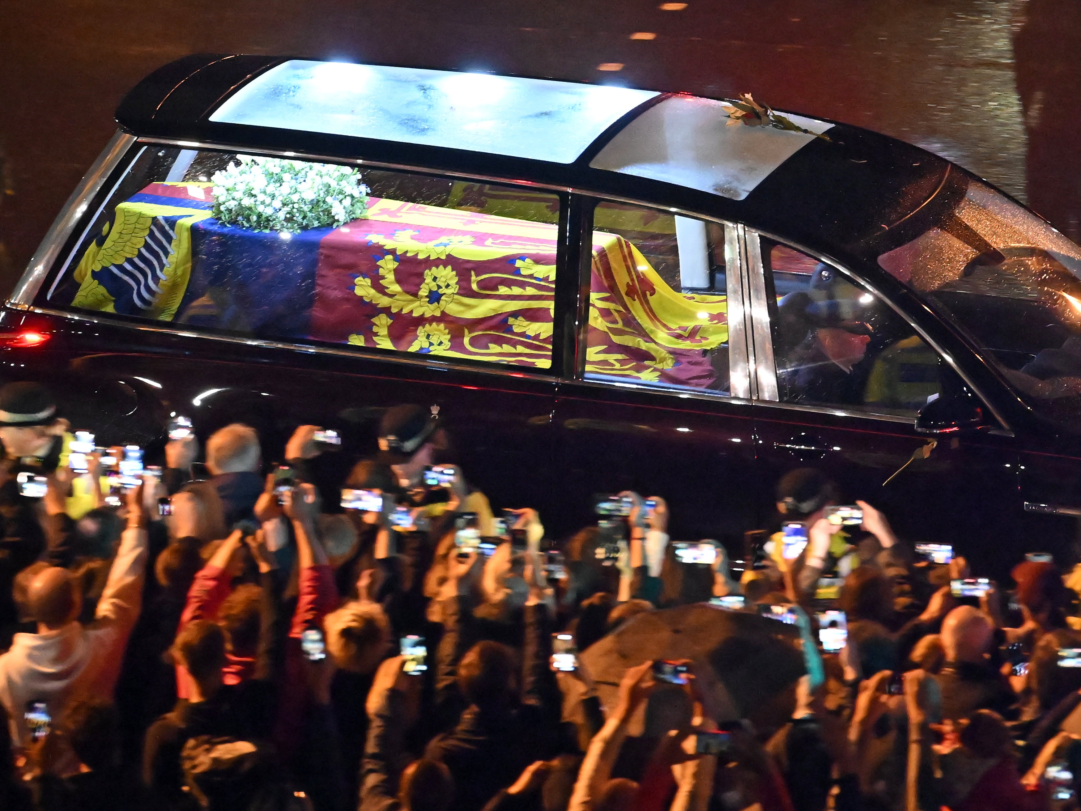 Seen from the top of the Wellington Arch, the coffin of Queen Elizabeth II is taken in a royal hearse to Buckingham Palace