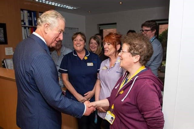 Michelle Beaver shaking Charles’ hand at the Marie Curie Hospice in Liverpool in February 2019 (Michelle Beaver/Marie Curie Hospice/PA)