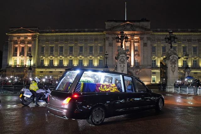 The hearse carrying the coffin of the Queen arrives at Buckingham Palace on Tuesday (Gareth Fuller/PA)