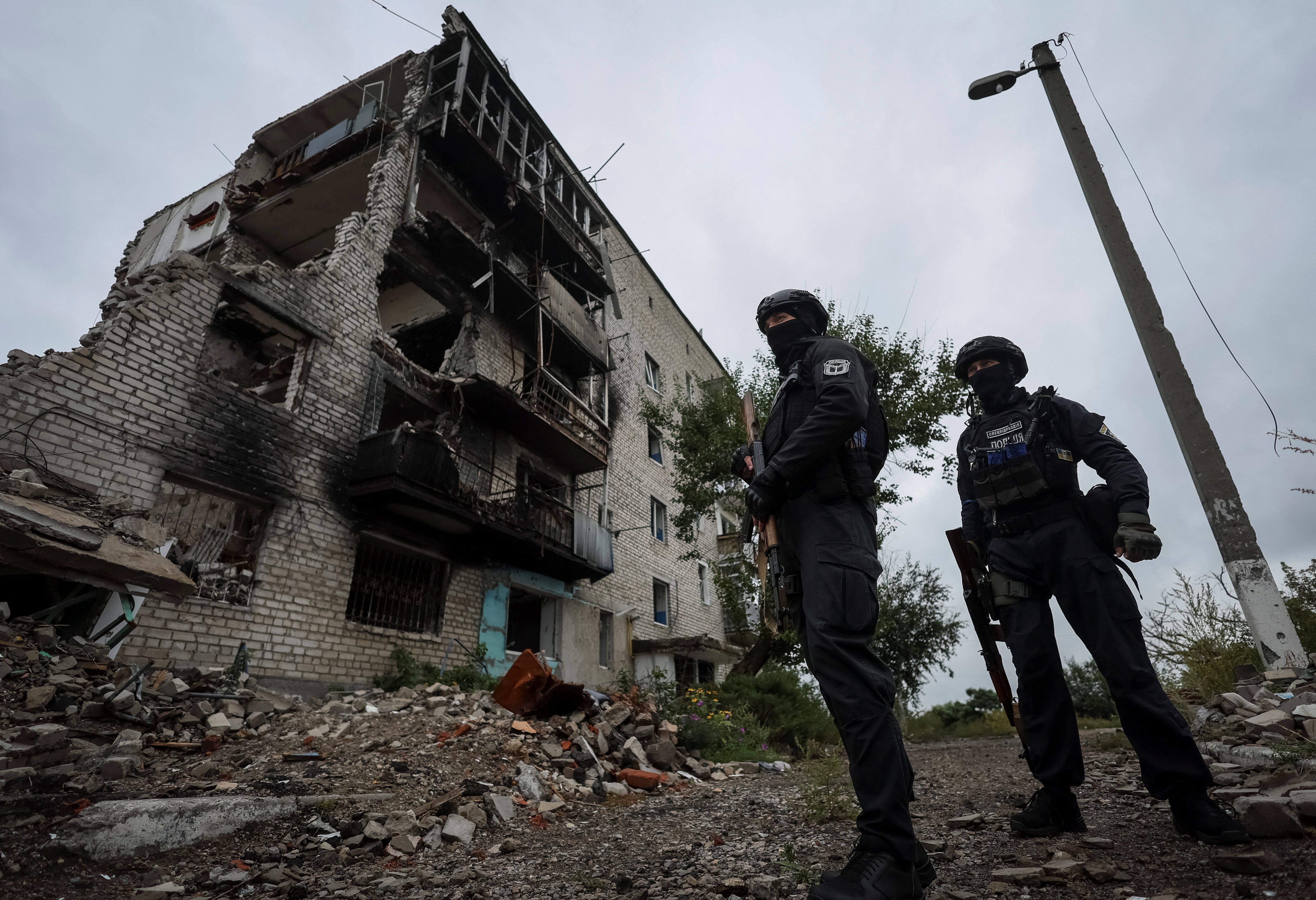 Ukrainian police patrol an area in Kharkiv oblast on 14 September, 2022.