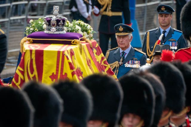 The King and the Prince of Wales (right) follow the Queen’s coffin on the procession to Westminster Hall (Aaron Chown/PA)