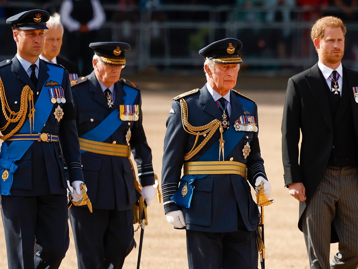Prince Harry wears medals pinned to suit after being banned from wearing uniform at Queen's procession | The Independent
