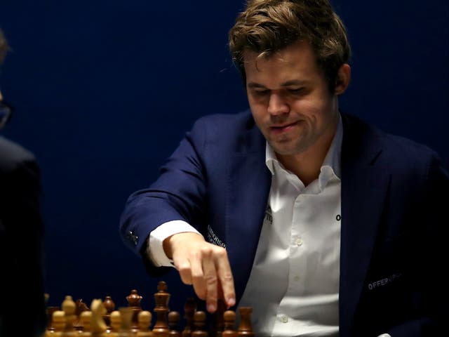 <p>Magnus Carlsen of Norway competes against Fabiano Caruana of USA during the 83rd Tata Steel Chess Tournament held in Dorpshuis De Moriaan on January 27, 2021 in Wijk aan Zee, Netherlands </p>
