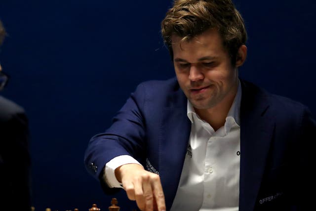 <p>Magnus Carlsen of Norway competes against Fabiano Caruana of USA during the 83rd Tata Steel Chess Tournament held in Dorpshuis De Moriaan on January 27, 2021 in Wijk aan Zee, Netherlands </p>
