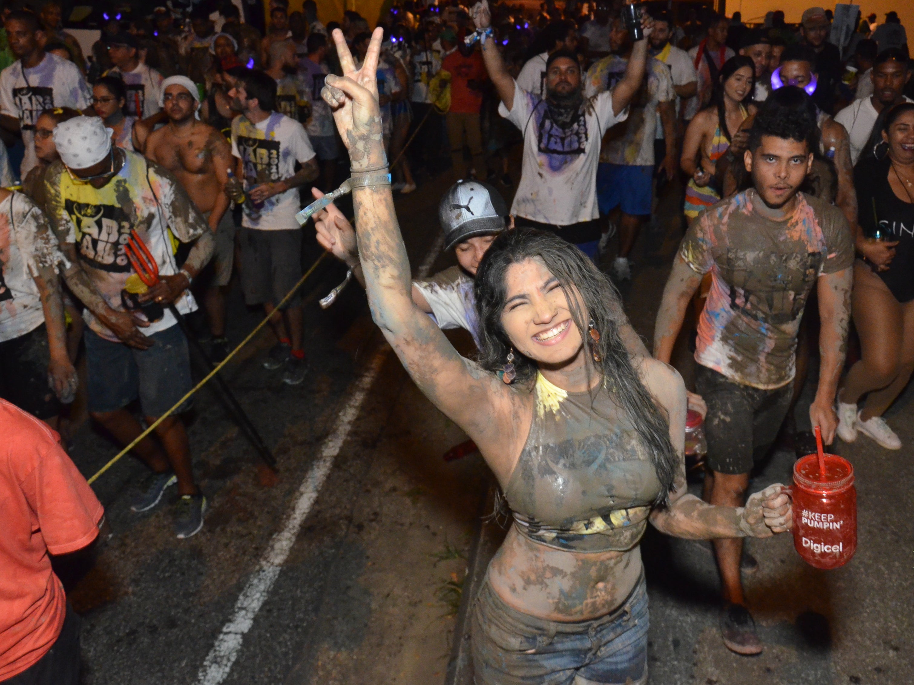 Revellers get down and dirty at the pre-dawn parties of J’ouvert