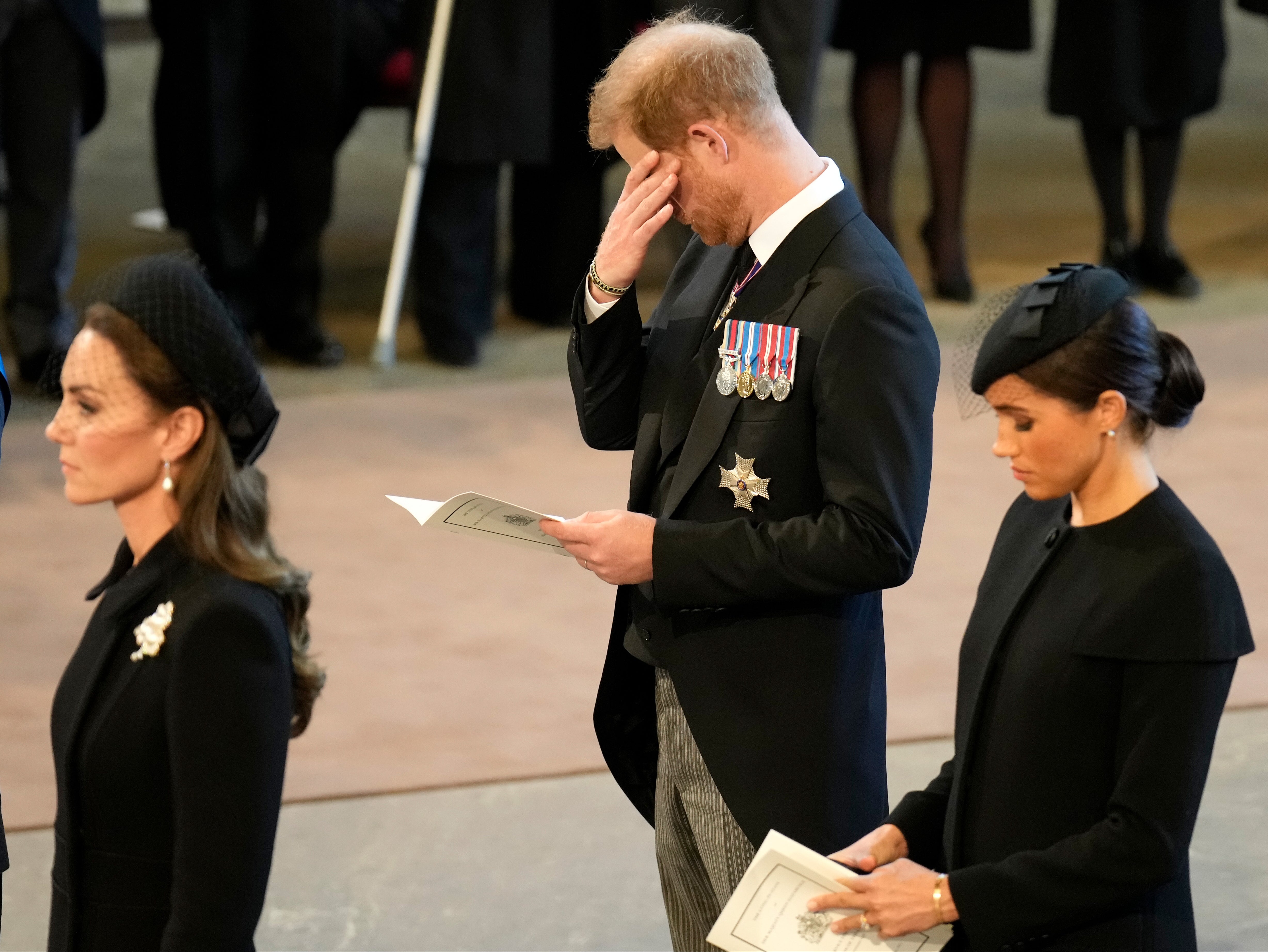 Prince Harry cannot hide his emotion at the lying-in-state