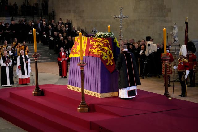 The coffin of Queen Elizabeth II, draped in the Royal Standard with the Imperial State Crown placed on top, lays on the catafalque in Westminster Hall (PA)