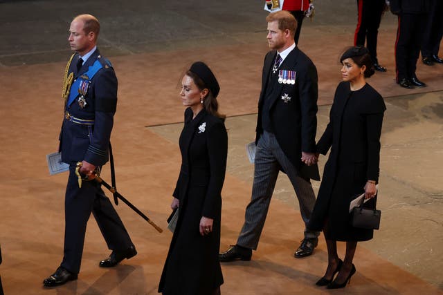 <p>Prince Harry and Meghan Markle hold hands as they exit Westminster Hall service</p>