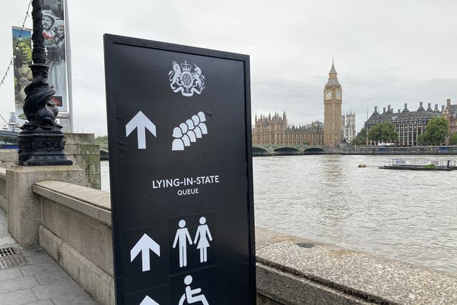 Signage on the South Bank, London, for members of the public to wait in the queue to view Queen Elizabeth II lying in state ahead of her funeral on Monday. (David Hughes/PA)