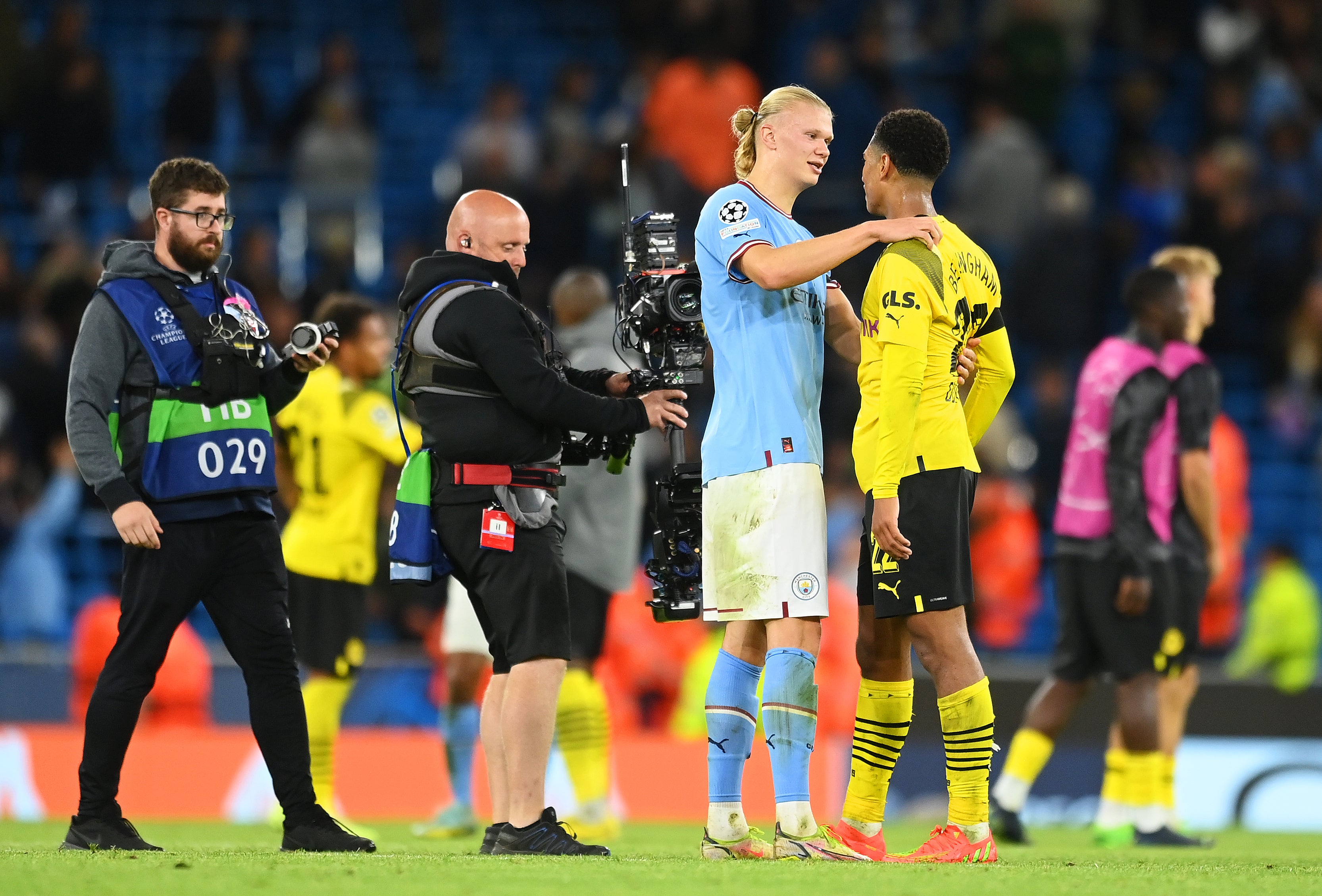 The Manchester City striker interacts with Jude Bellingham of Borussia Dortmund at the end of the game