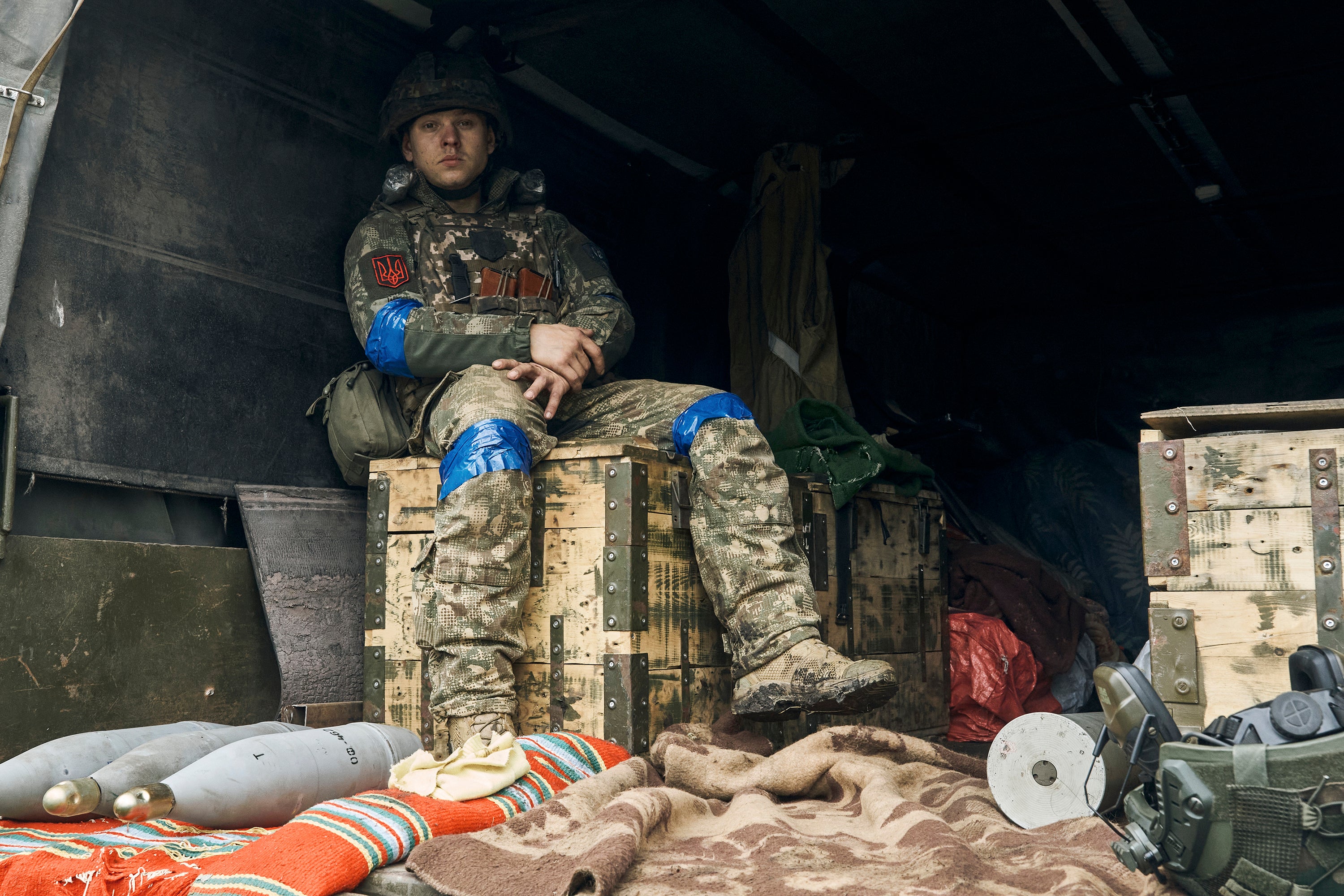 A Ukrainian soldier sits inside a truck in the recently retaken Kupiansk earlier this month