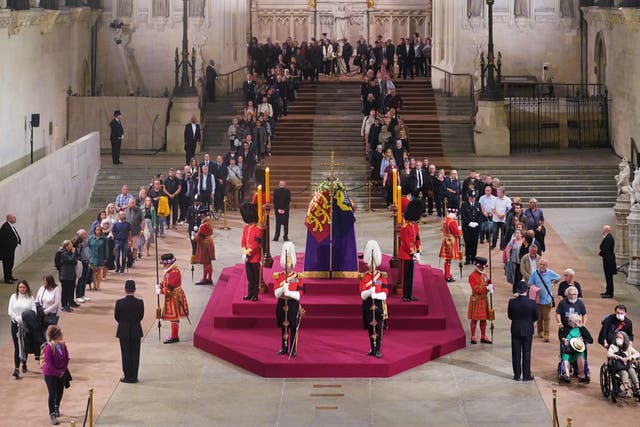 The first members of the public pay their respects at Westminster Hall (Yui Mok/PA)