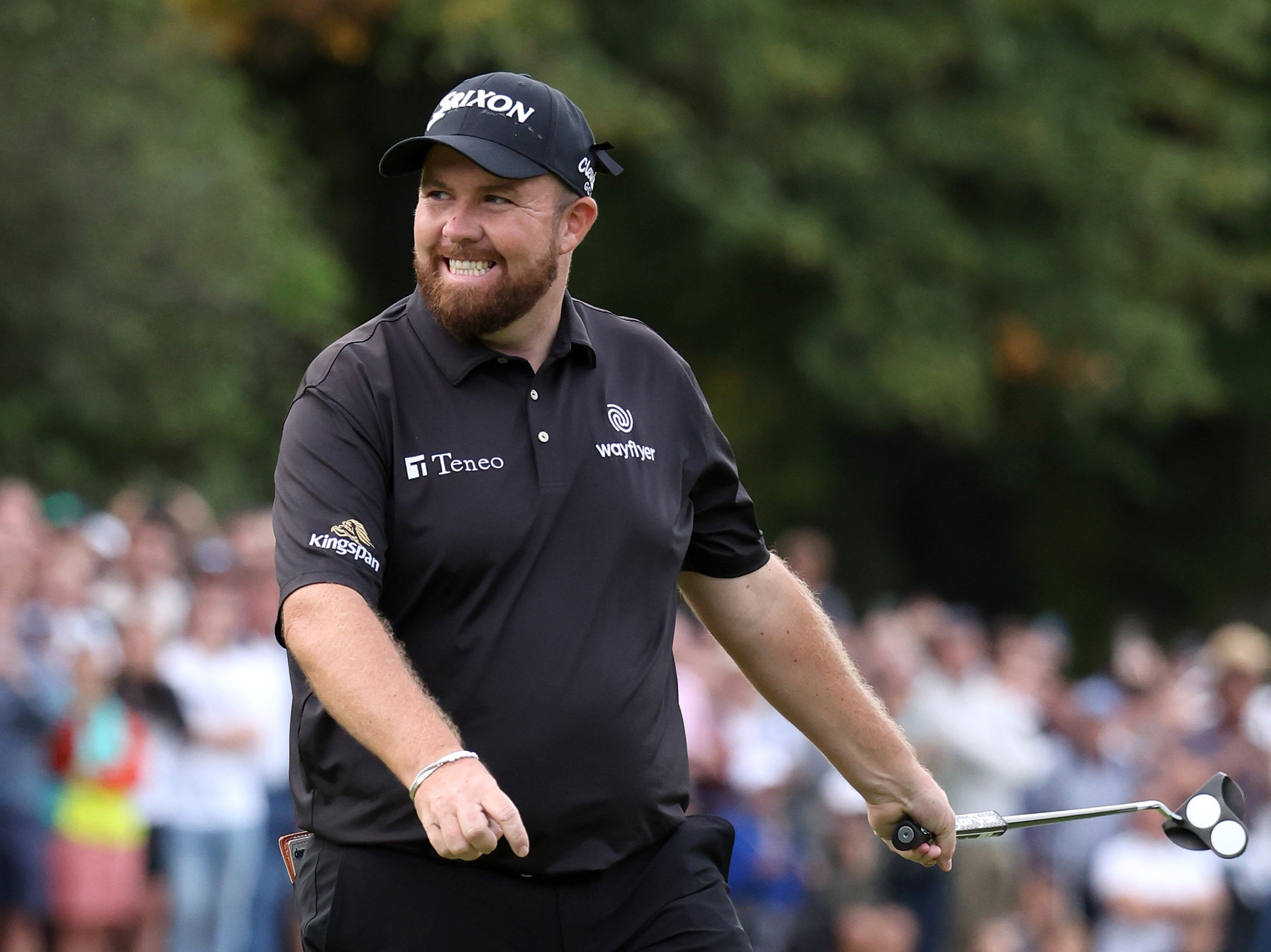 Shane Lowry of Ireland celebrates after putting on the 18th hole at Wentworth