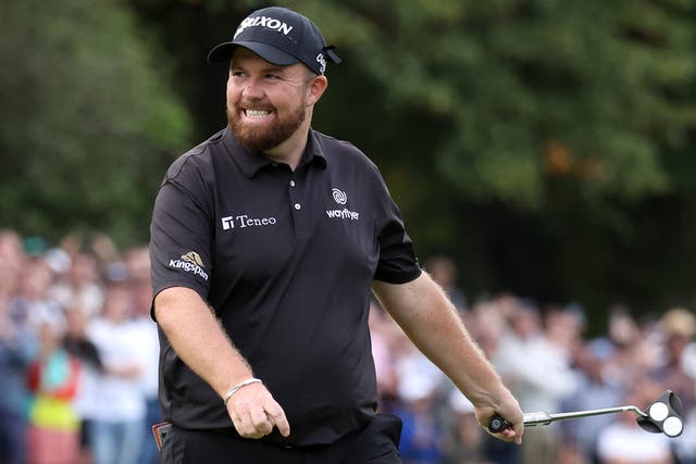 <p>Shane Lowry of Ireland celebrates after putting on the 18th hole at Wentworth</p>