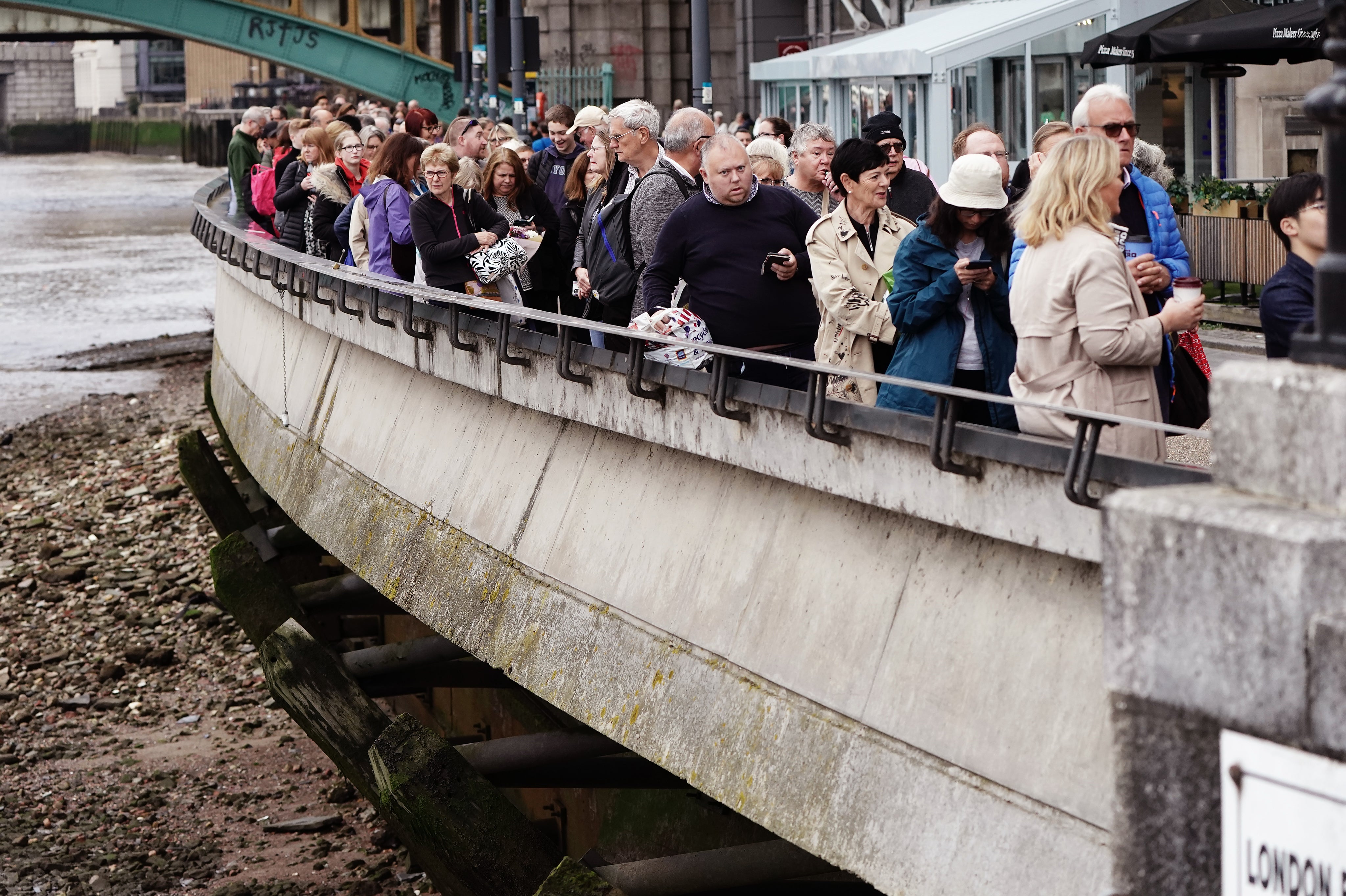 People queue on the South Bank (Aaron Chown/PA)