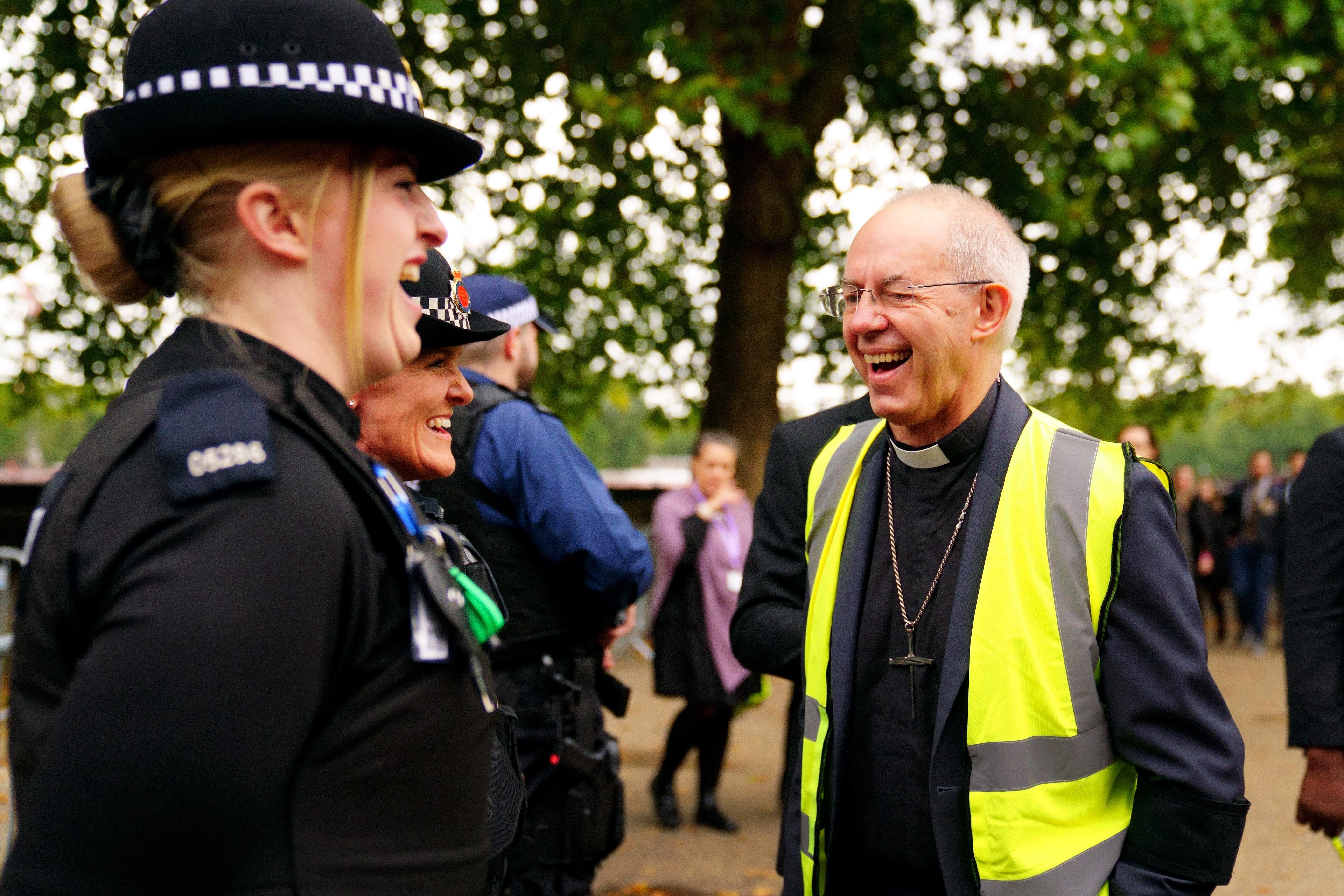 The Archbishop of Canterbury, Justin Welby, talks to police officers (Victoria Jones/PA)