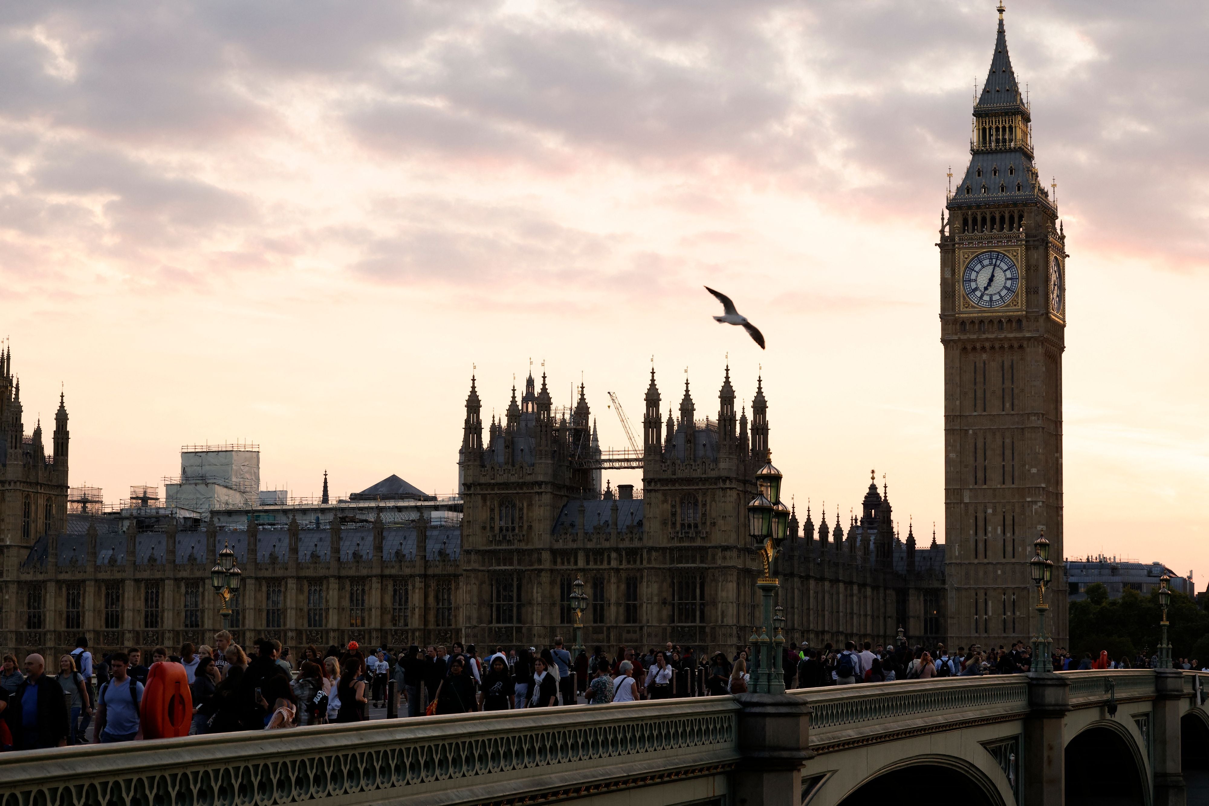 Members of the public queue on Westminster Bridge to pay their respects to the Queen