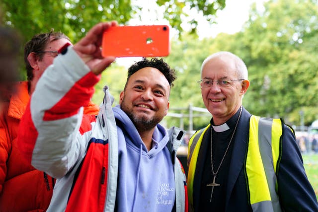 Archbishop of Canterbury Justin Welby talks to people near the final section of the queue to see the coffin of the Queen (Victoria Jones/PA)