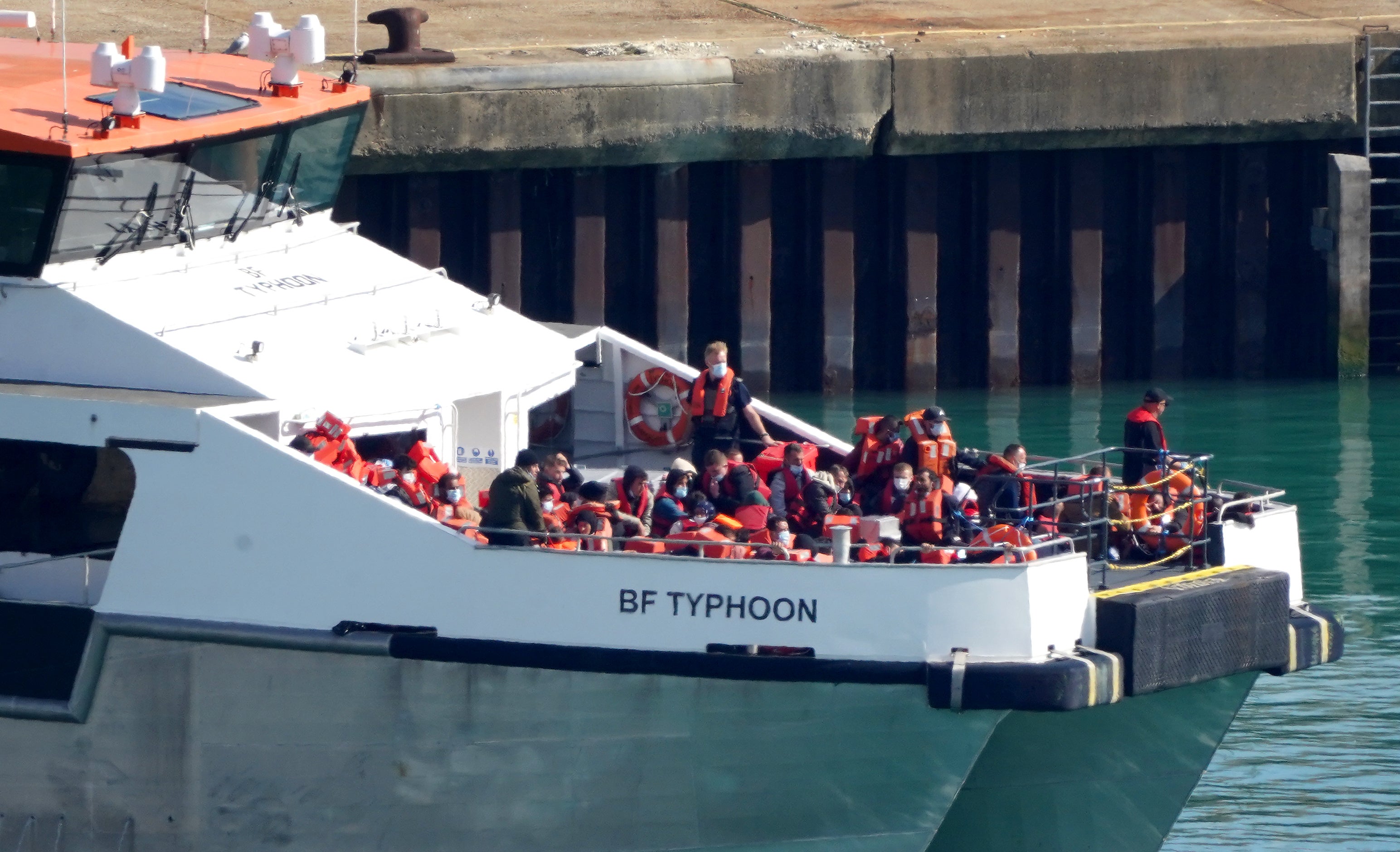 A group of people, thought to be migrants, are brought in to Dover, Kent, on board a Border Force vessel (Gareth Fuller/PA)