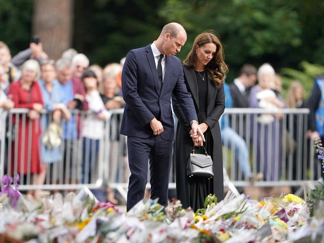 <p>The Prince and Princess of Wales looking at floral tributes at Sandringham House  </p>