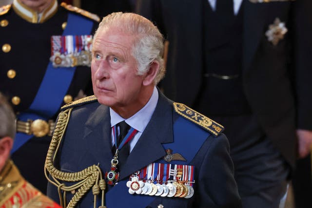 King Charles III with coffin of Queen Elizabeth II in Westminster Hall, London, where it will lie in state ahead of her funeral on Monday. Picture date: Wednesday September 14, 2022.