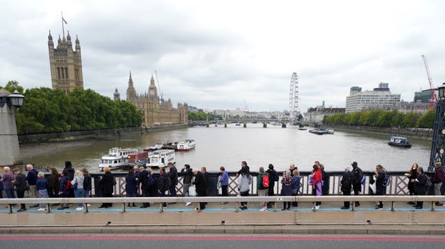 Members of the public queue on Lambeth Bridge (Jacob King/PA)