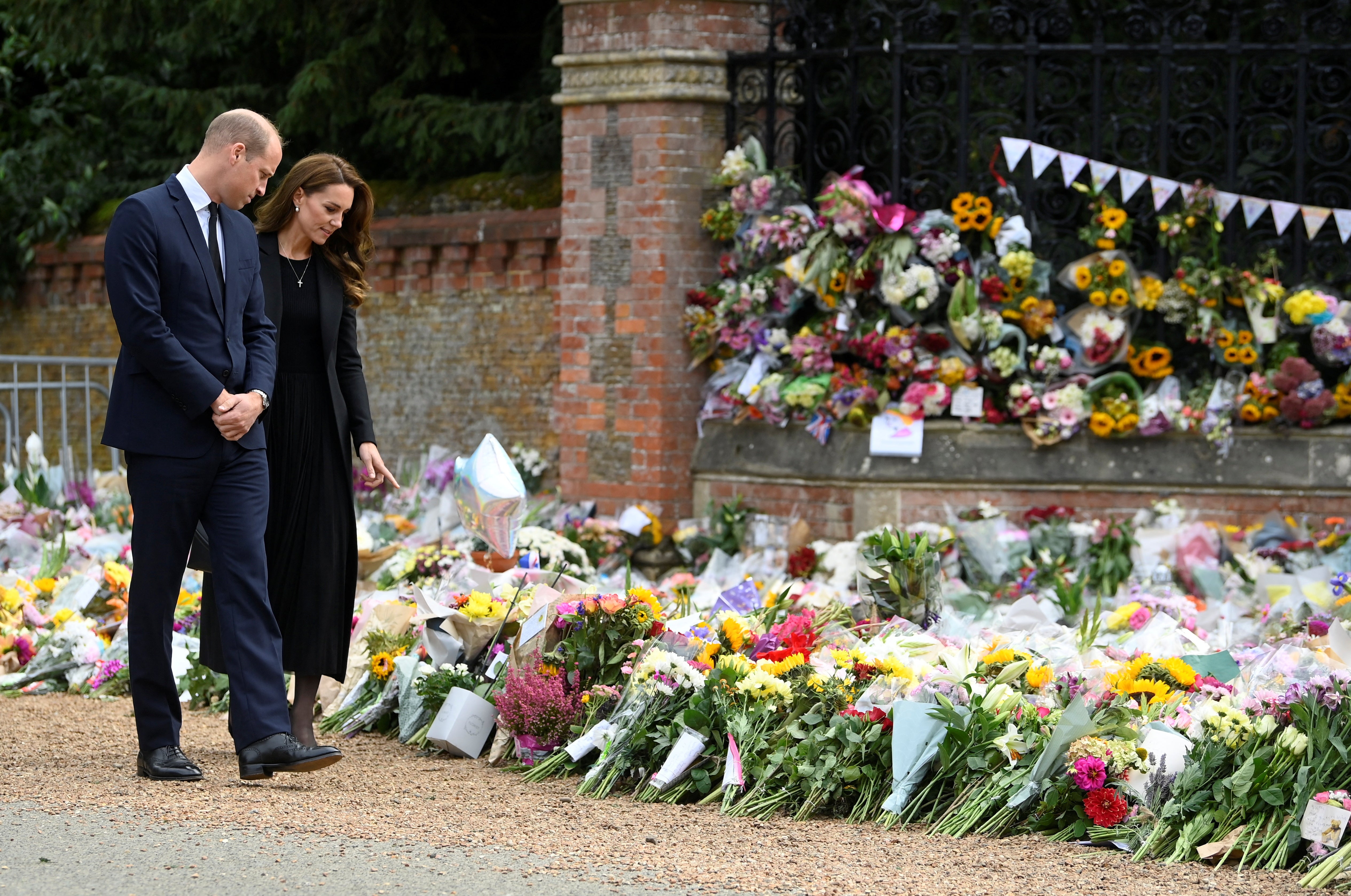 The Prince and Princess of Wales view the floral tributes (Toby Melville/PA)