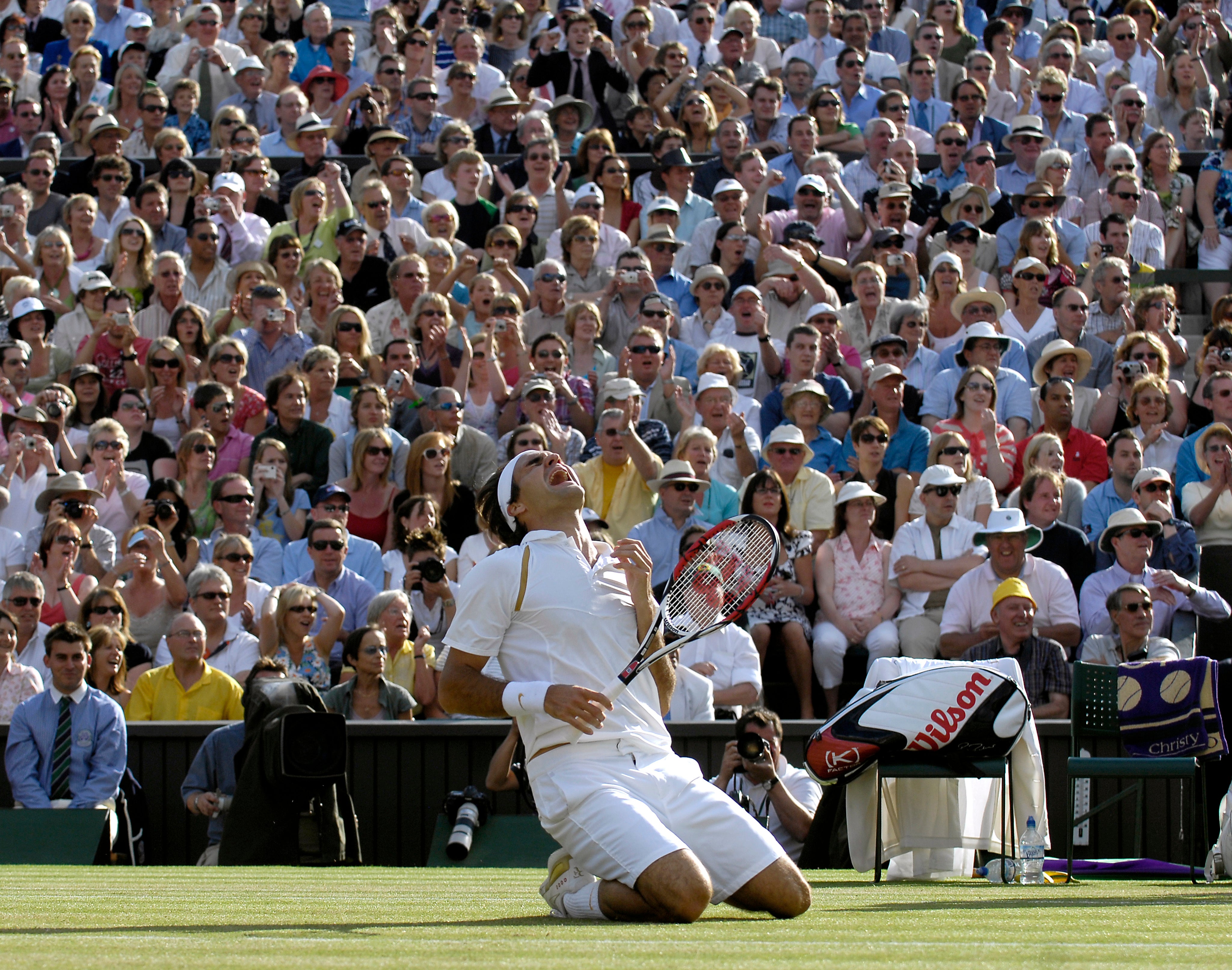 Federer sinks to his knees after beating Nadal in the 2007 final to take the title for a fifth time (Rebecca Naden/PA)
