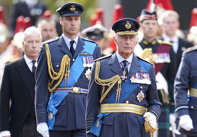 King Charles III (centre) and the Prince of Wales walks behind the coffin of Queen Elizabeth II (PA)
