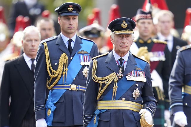King Charles III (centre) and the Prince of Wales walks behind the coffin of Queen Elizabeth II (PA)