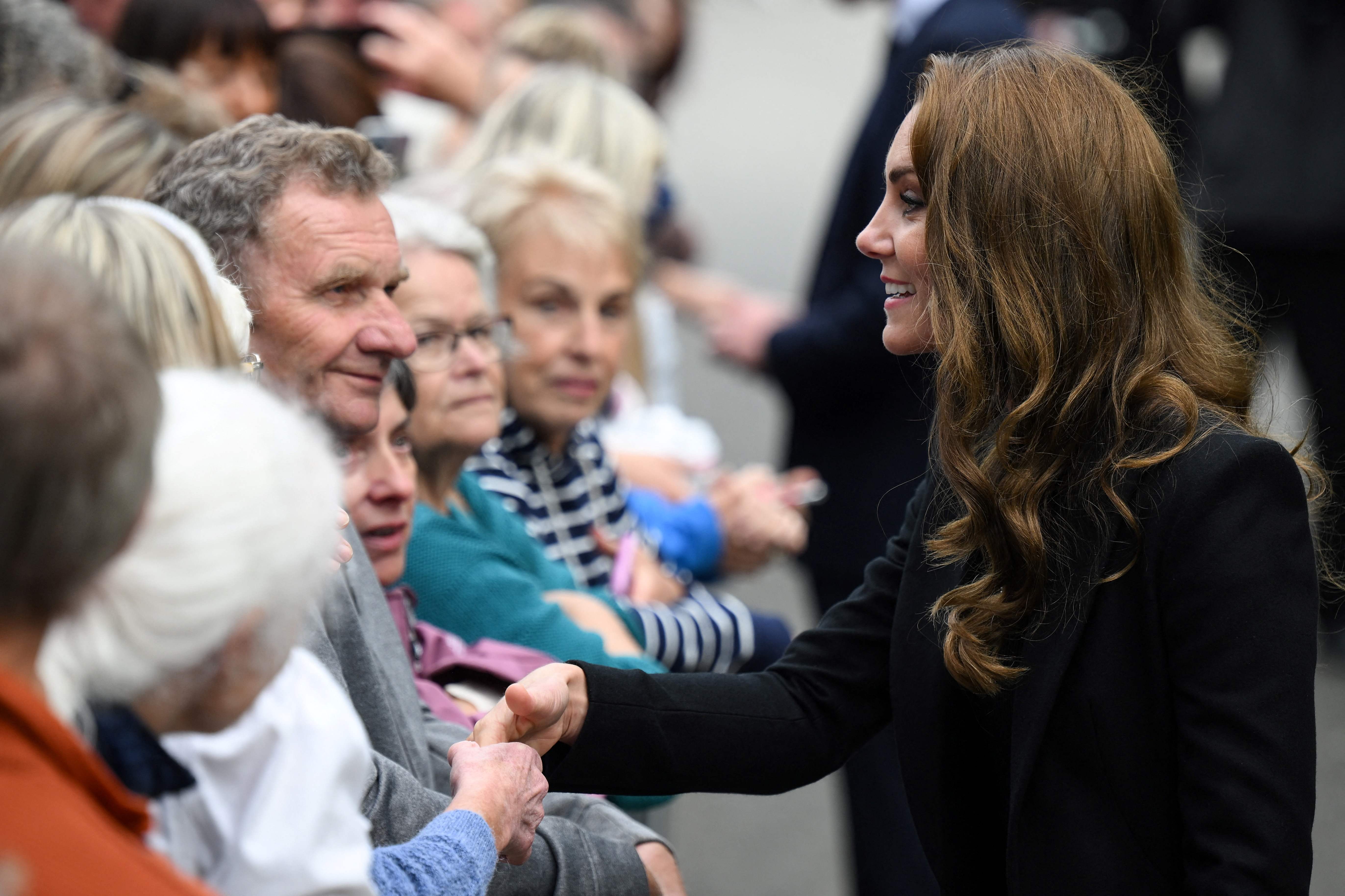 The Princess of Wales speaks to members of the public outside the Sandringham Estate