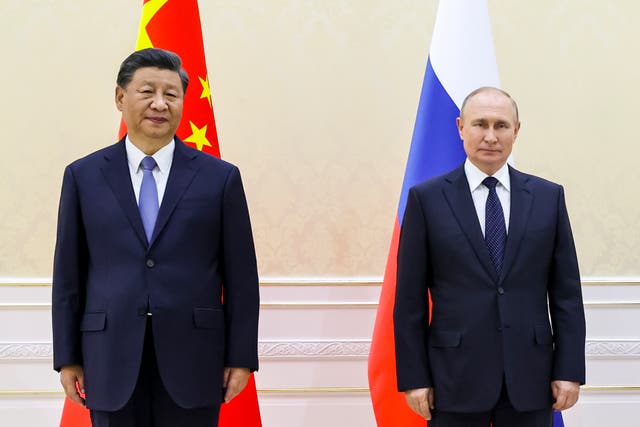 <p>Chinese President Xi Jinping, left, and Russian President Vladimir Putin pose for a photo on the sidelines of the Shanghai Cooperation Organization (SCO) summit in Samarkand</p>