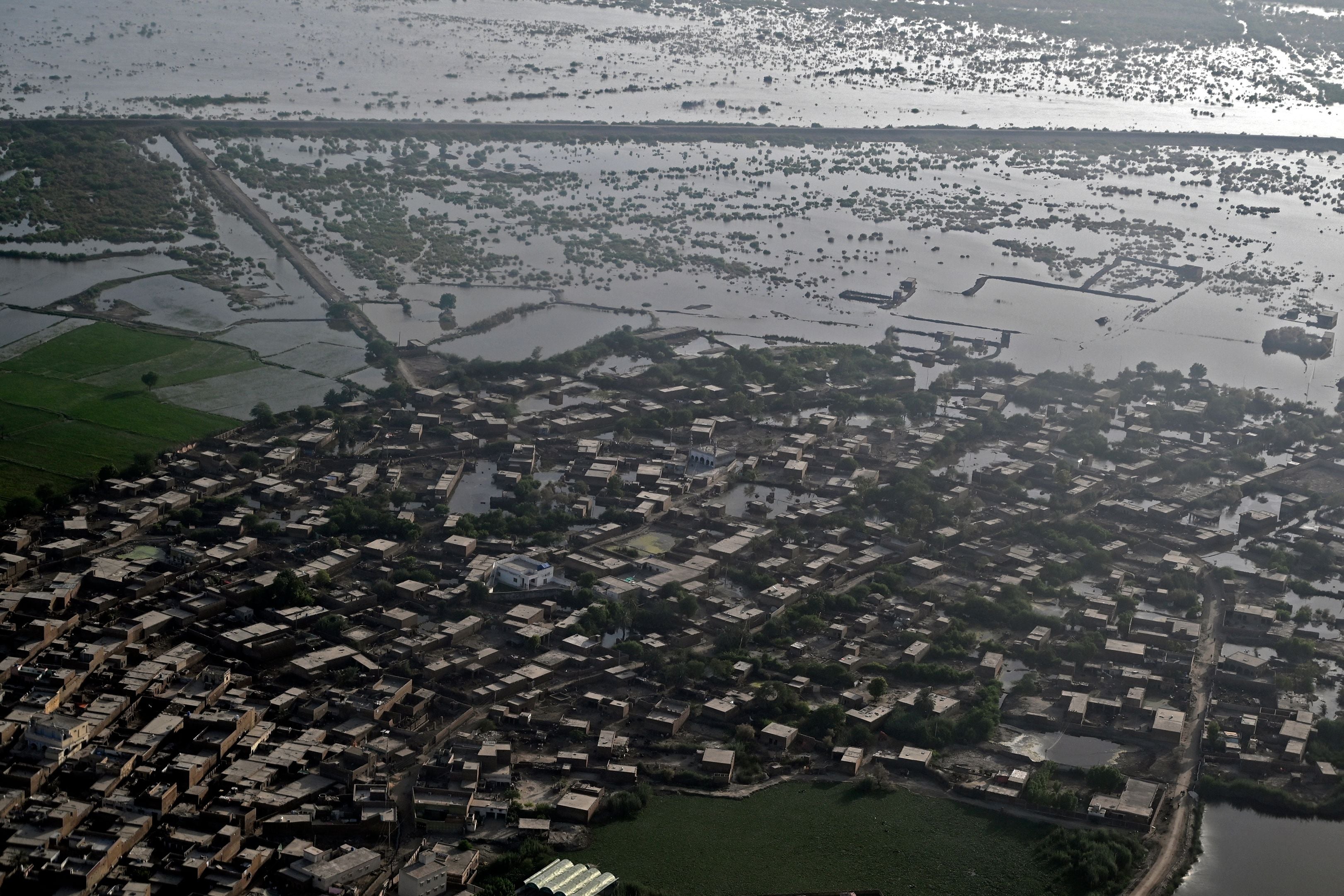 This aerial photograph taken shows flooded residential areas after heavy monsoon rains in Sukkur, Sindh province