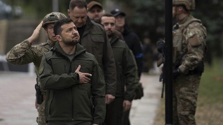 Volodymyr Zelensky sings national anthem as Ukraine flag raised in reclaimed Izyum