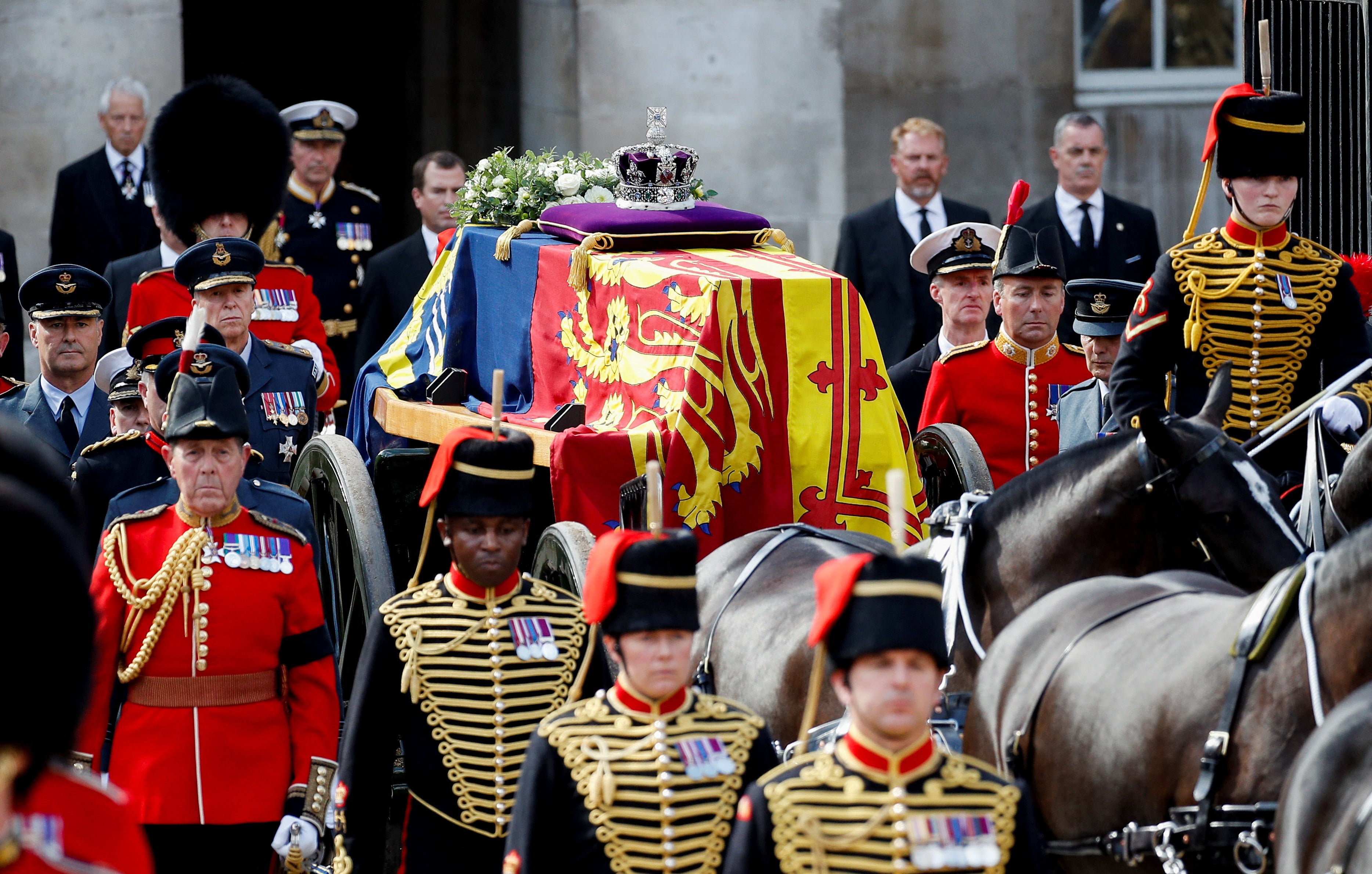 The Queen’s coffin carried on a horse-drawn gun carriage during the ceremonial procession from Buckingham Palace to Westminster Hall on Wednesday (Peter Nicholls/PA)