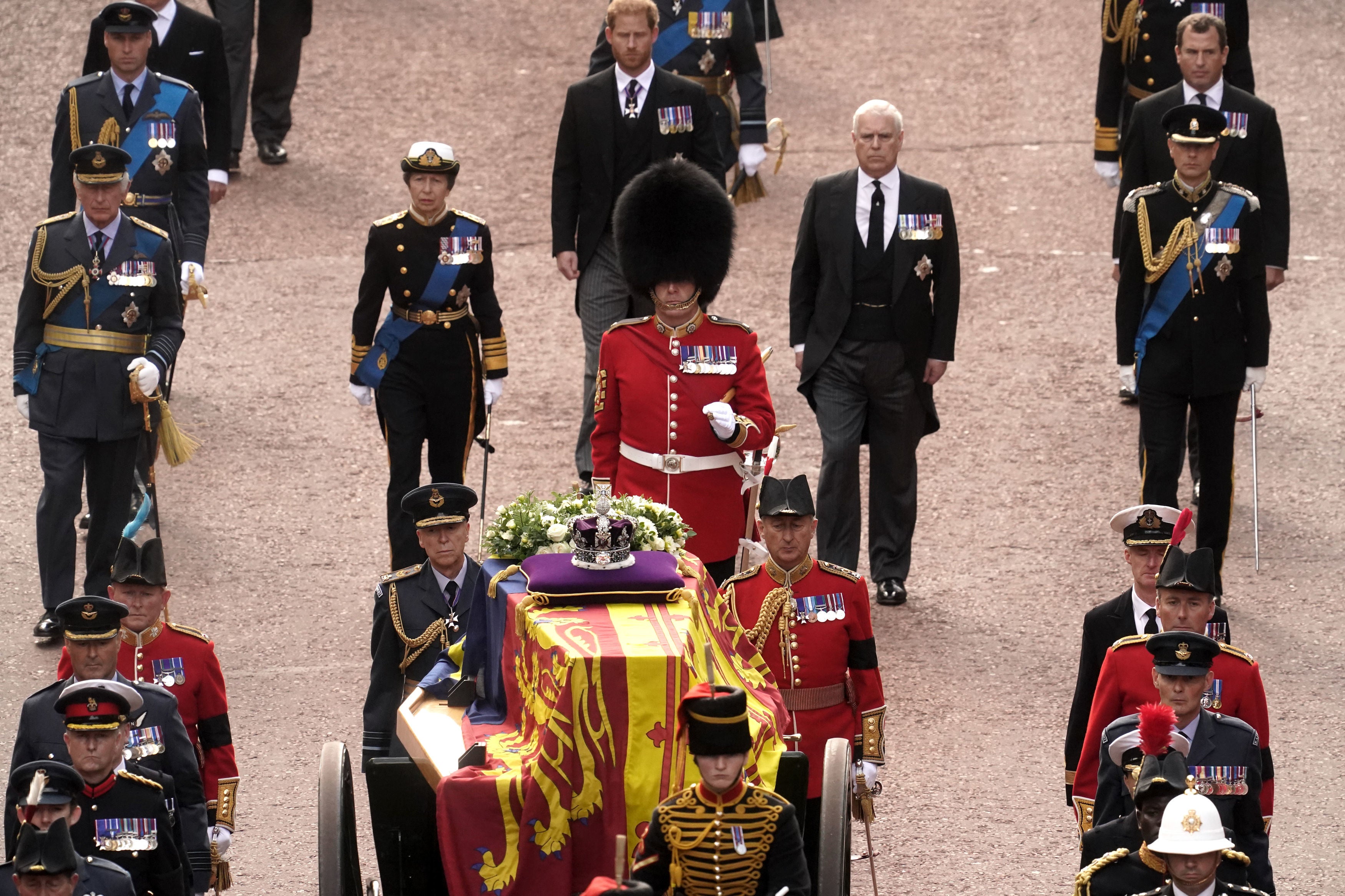 Members of the British royal family follow Queen Elizabeth II’s coffin during ceremonial procession