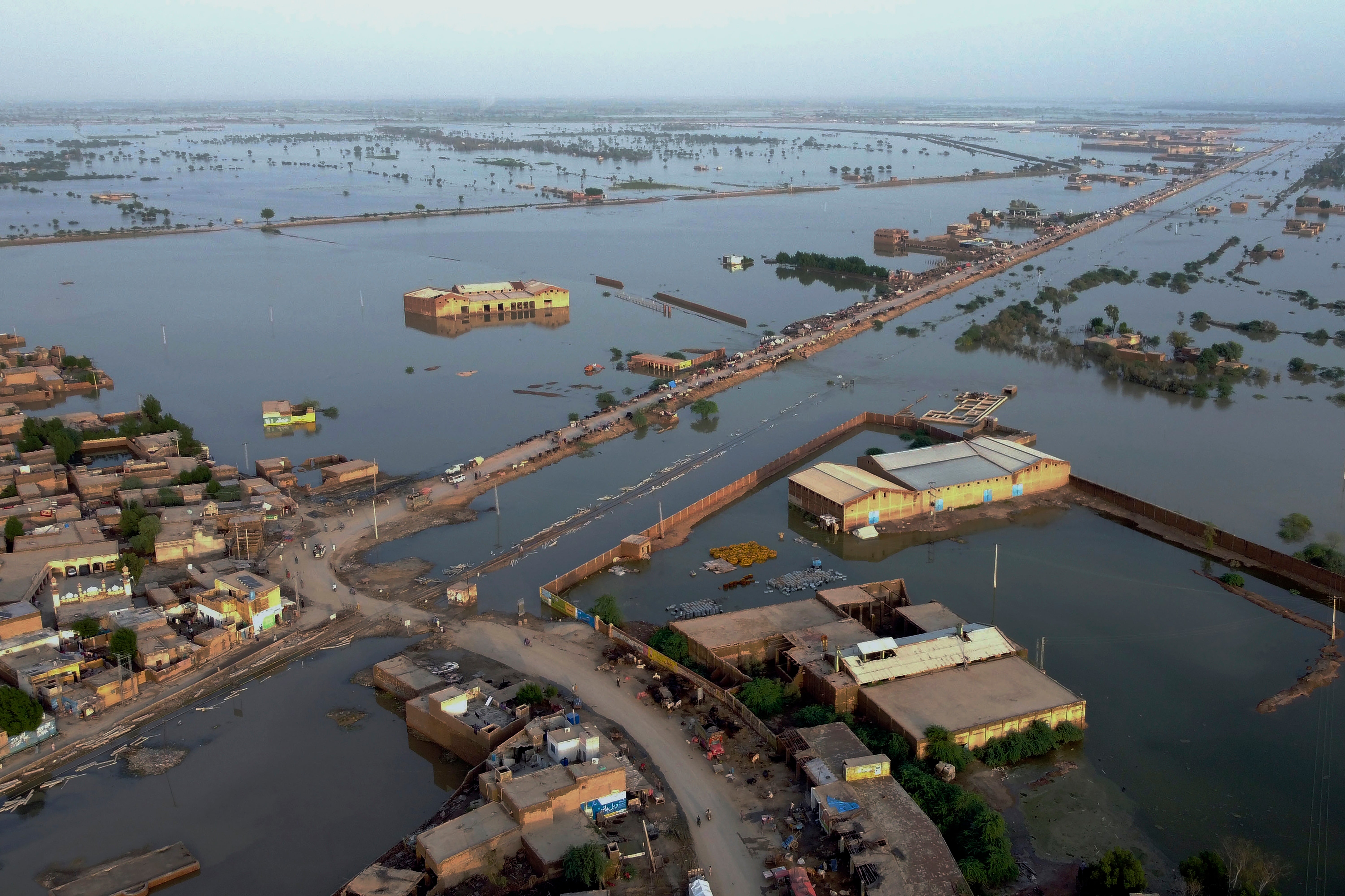 Homes are surrounded by floodwaters in Sohbat Pur city, a district of Pakistan’s southwestern Baluchistan province