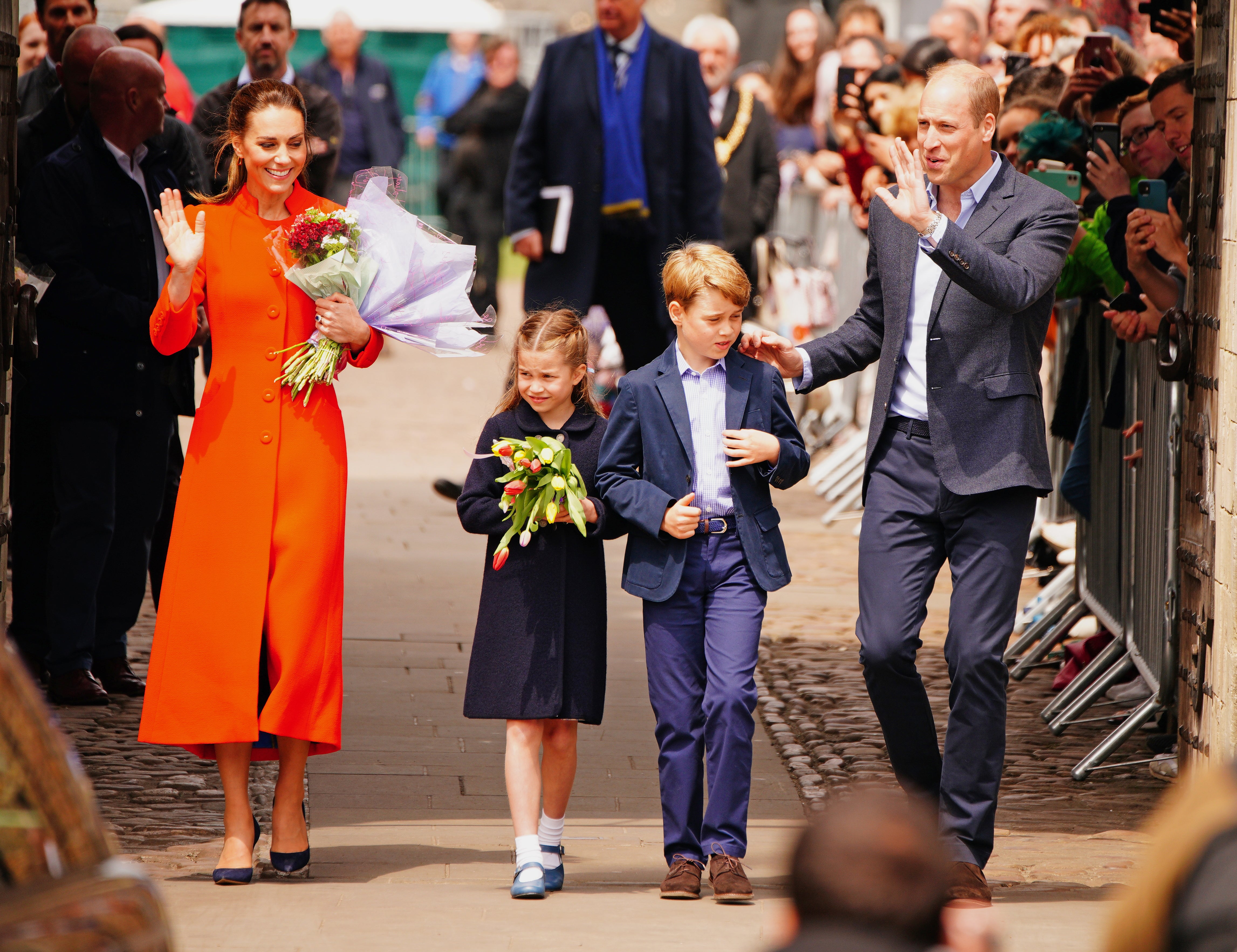 The Duke and Duchess of Cambridge and Prince George and Princess Charlotte speak to well-wishers during their visit to Cardiff Castle in June (PA)