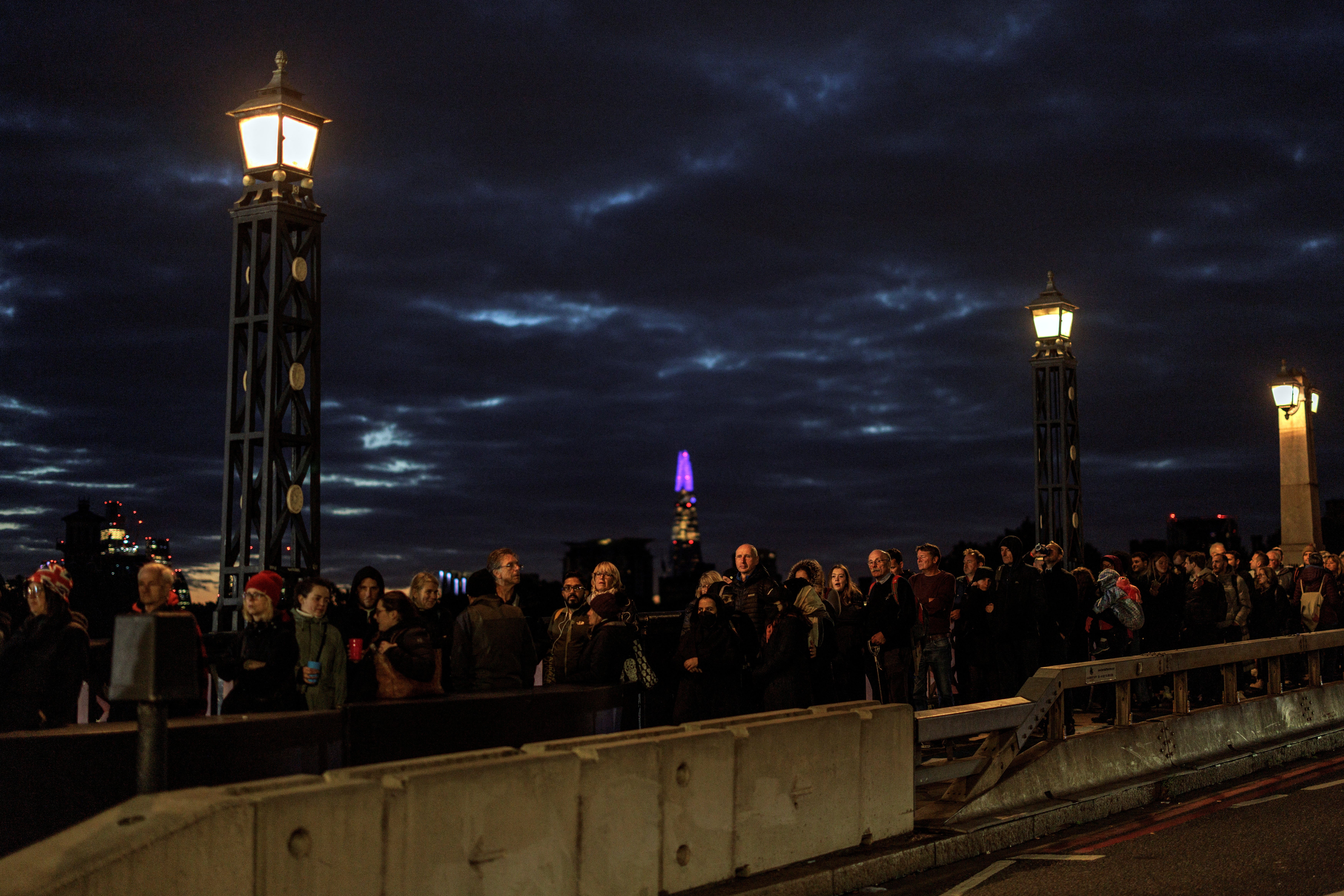 People queue on Lambeth Bridge through the night to pay their respects to the Queen
