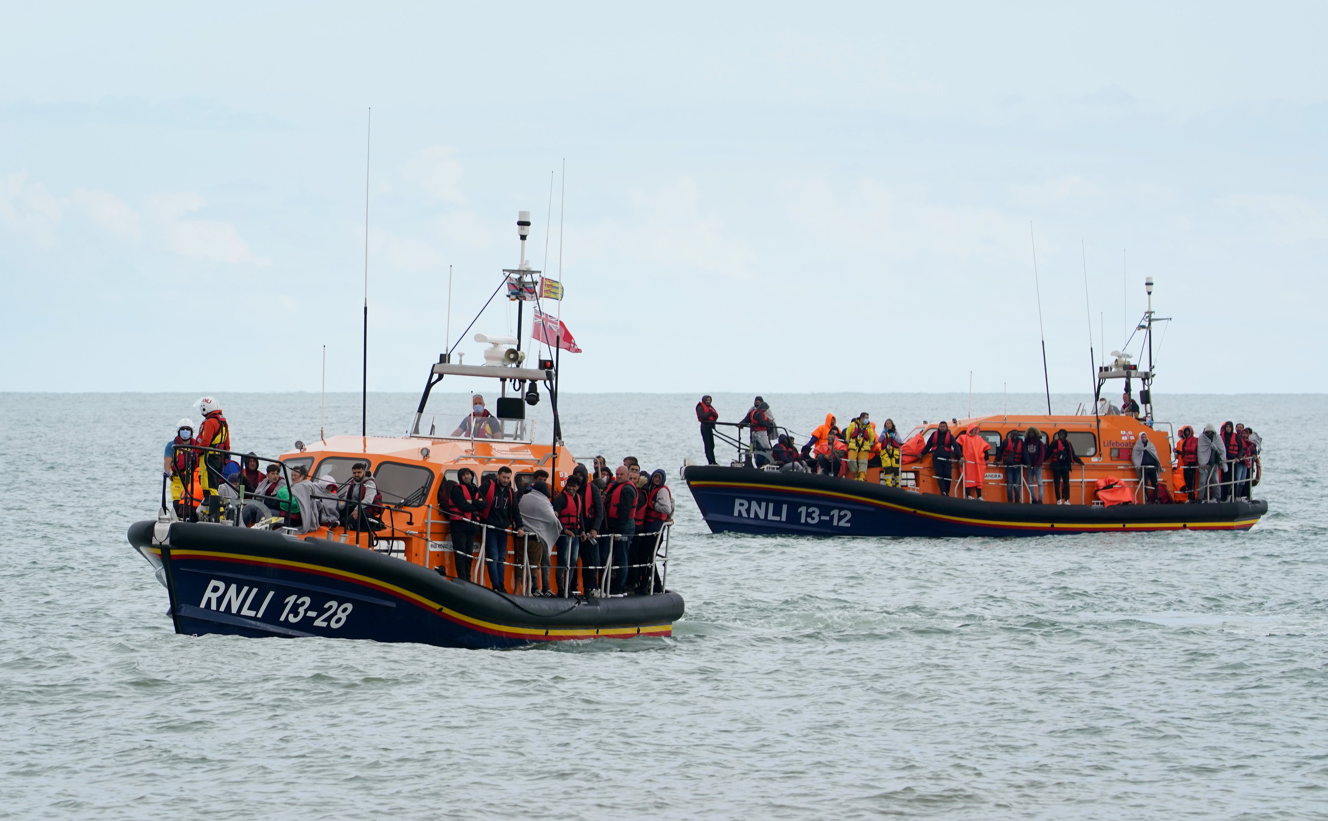 Dungeness and Hastings Lifeboats carrying groups of people thought to be migrants into Dungeness, Kent (Gareth Fuller/PA)