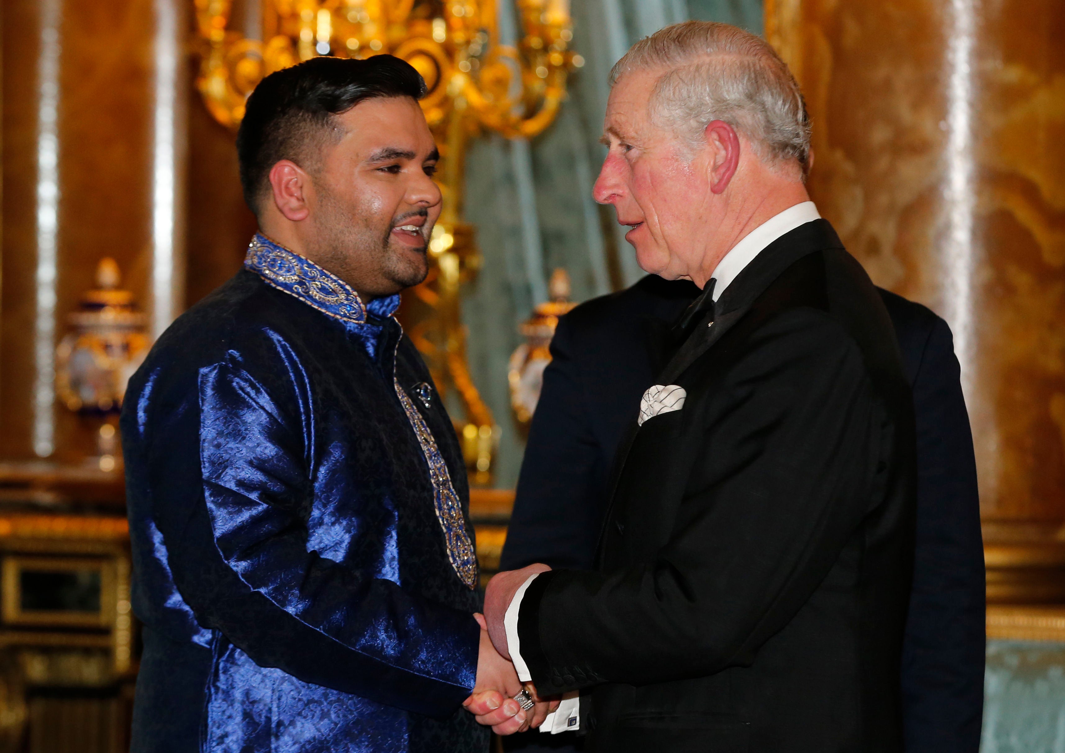 The Prince of Wales speaks to music producer Naughty Boy (PA)