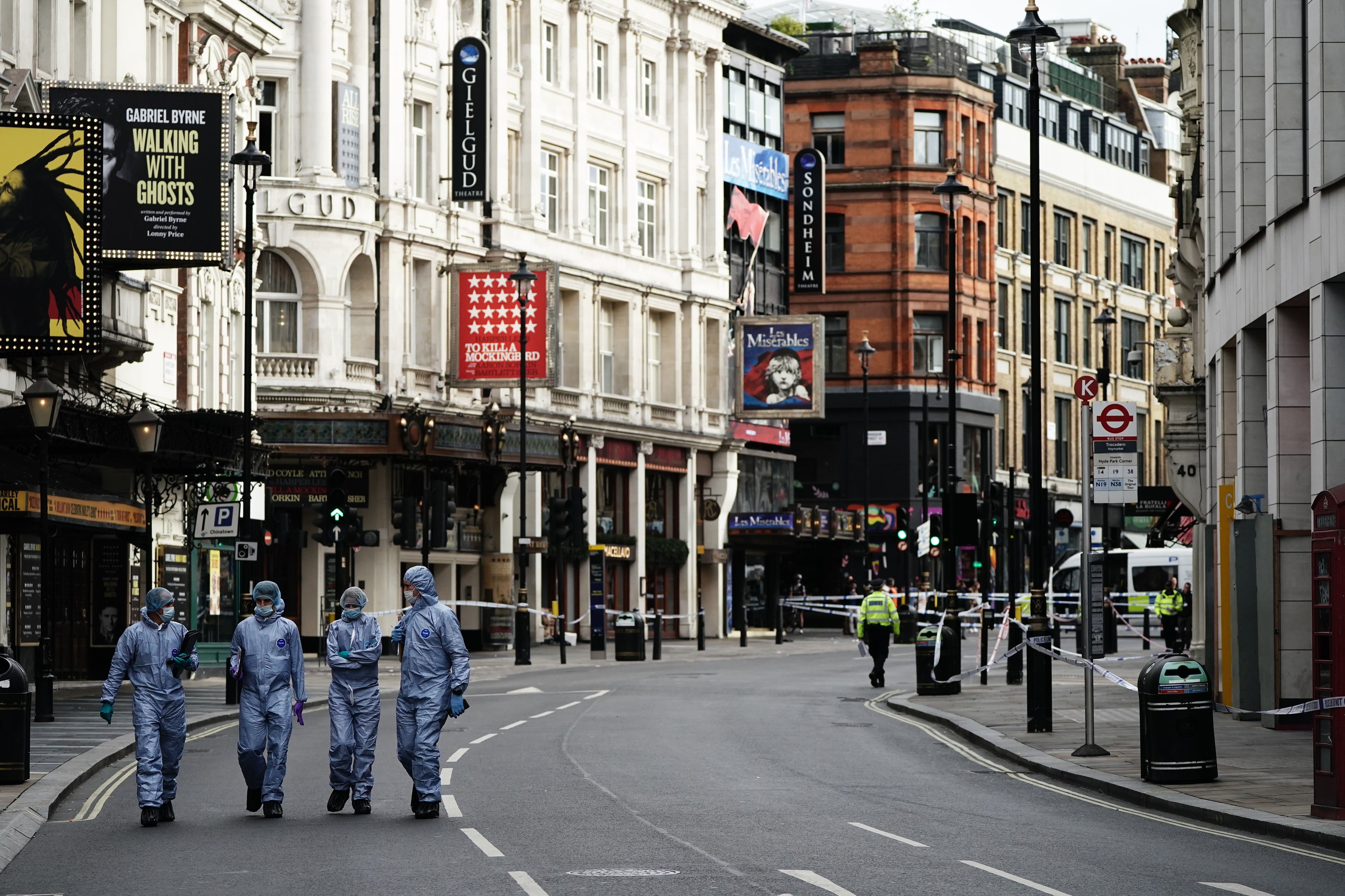 Forensics officers and police at the scene in Shaftesbury Avenue, central London (Aaron Chow/PA)