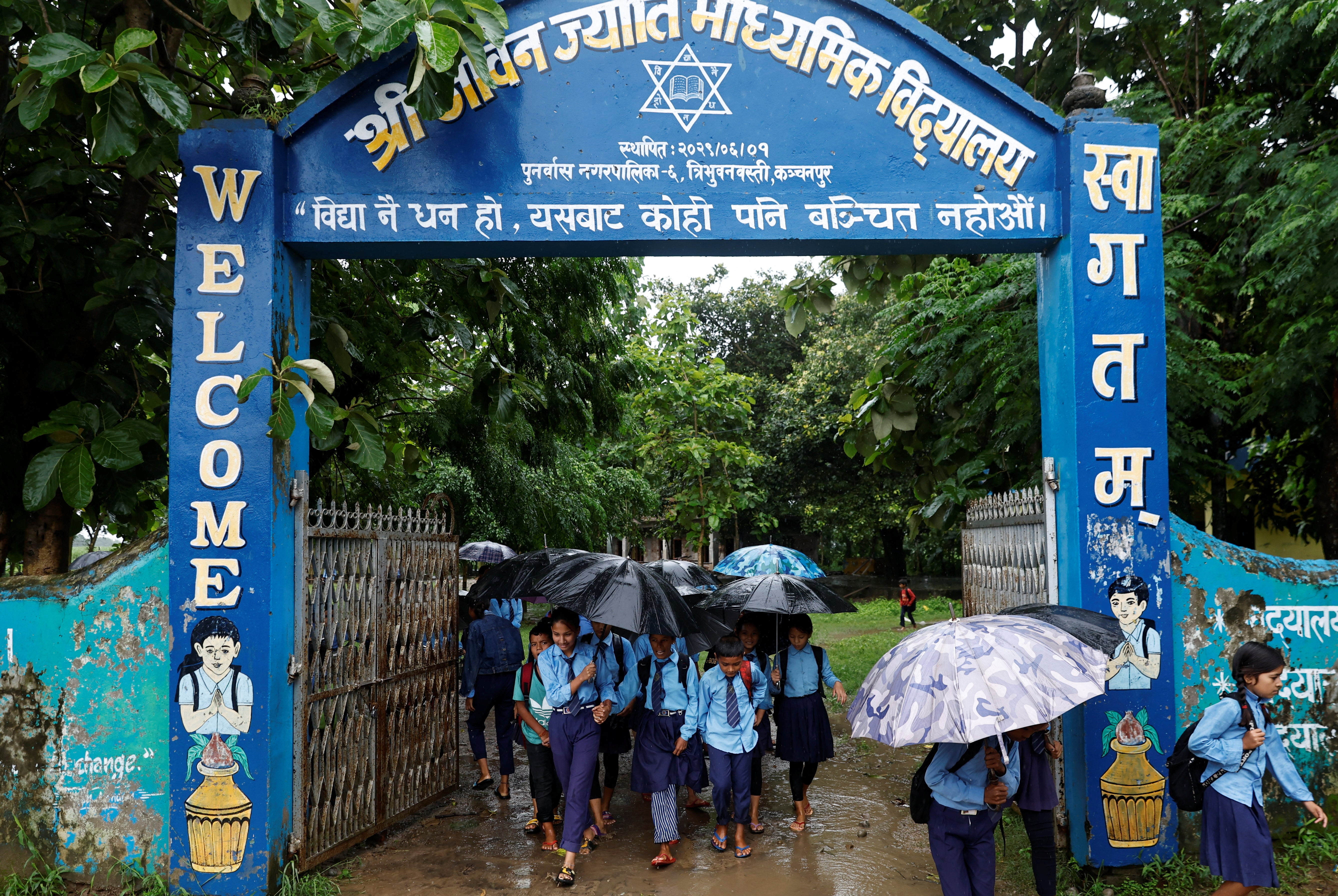 Parwati and her son Resham, 11, leave school to walk home