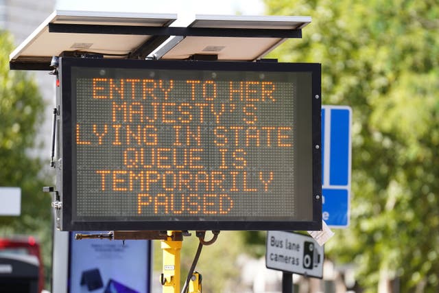 A sign in Bermondsey, south-east London, informing members of the public that the queue to view the Queen lying in state ahead of her funeral on Monday is temporarily paused (James Manning/PA)