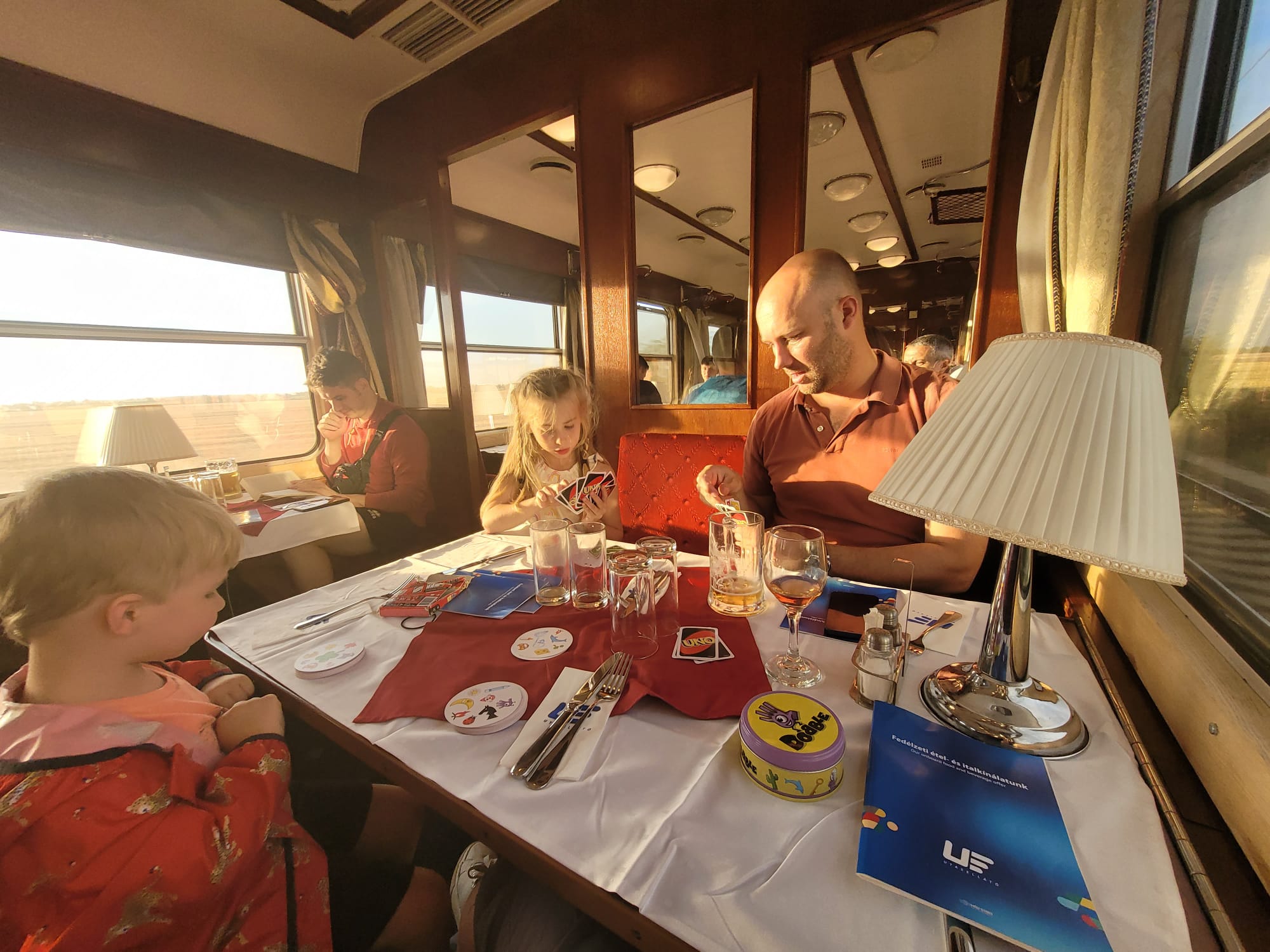 Dom and the kids in the Hungarian train’s dining car
