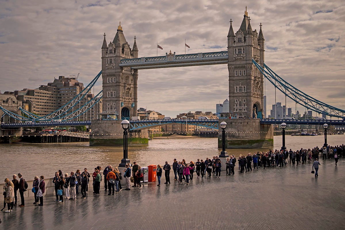 Queue for the Queen stretches 24 hours despite chilly forecast as Beckham and Ardern join mourners